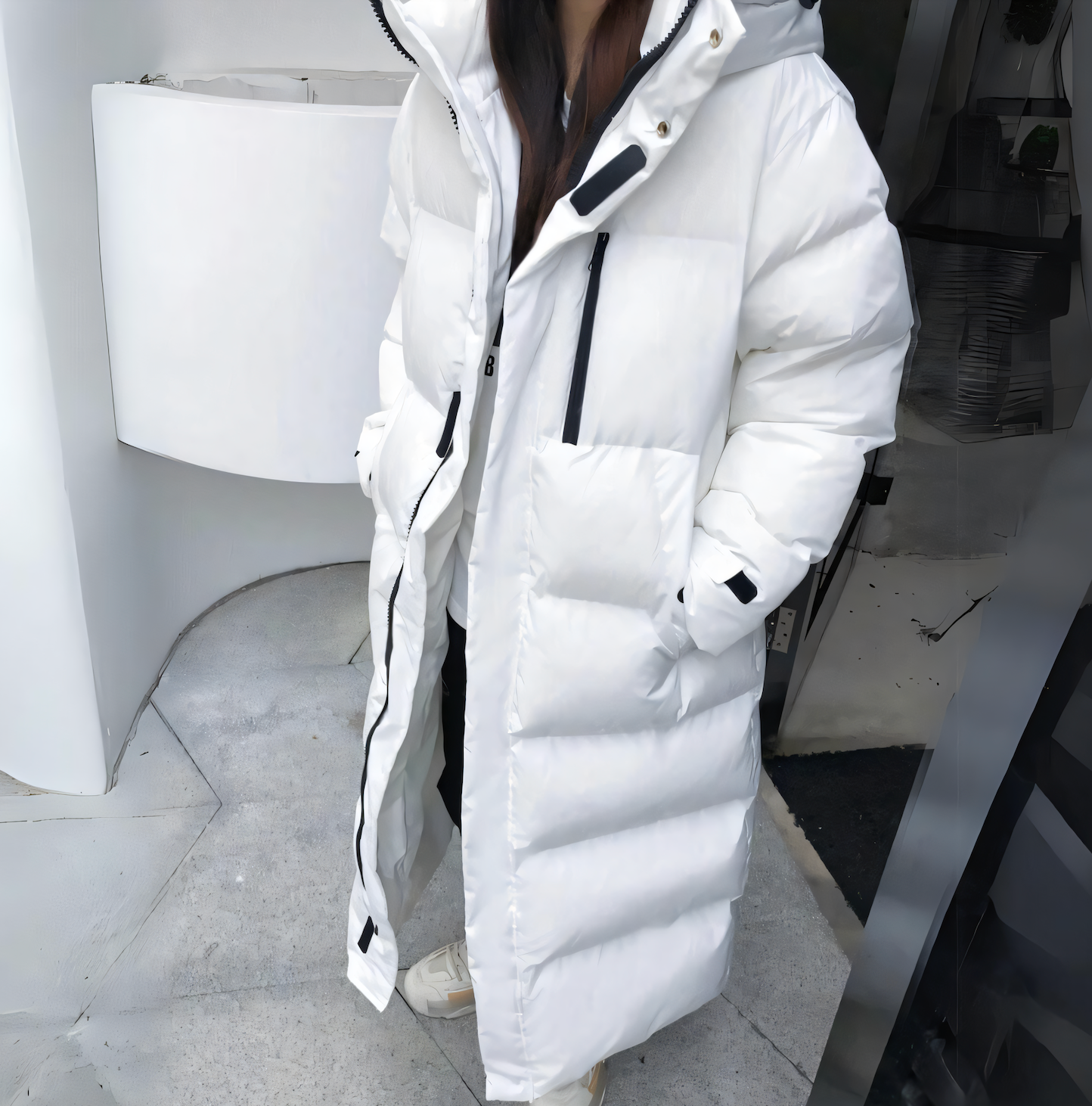 Winddichte lange Daunenjacke